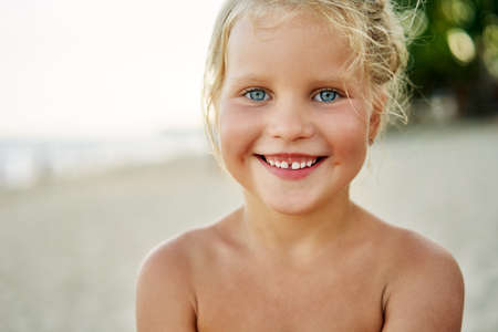 Close up portrait of happy cute little girlの写真素材