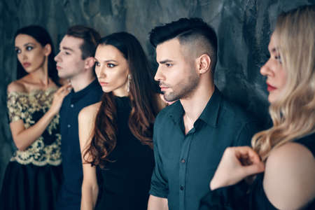 Group of young beautiful people posing in studioの写真素材