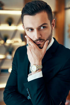 Thoughtful handsome beautiful man portraitの写真素材