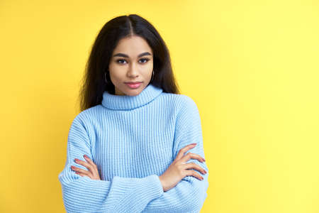 Portrait of confident beautiful black woman with crossed arms