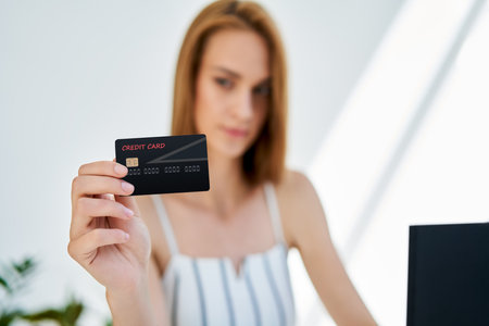 Young woman shopping online with laptop and credit cardの写真素材