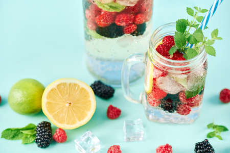 Fresh berries cocktail in glass jar