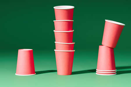 Set of red paper cups on green backgroundの写真素材