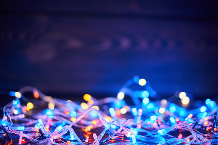 Colorful christmas lights background with copy space. Merry Christmas and Happy New Year festive...
