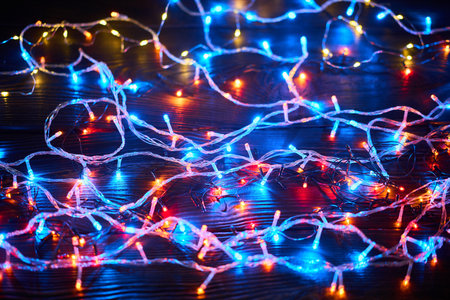 Colorful christmas lights background. Merry Christmas and Happy New Year festive compositionの写真素材