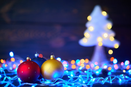 Christmas tree with christmas lights background. Merry Christmas and Happy New Year festive conceptの写真素材