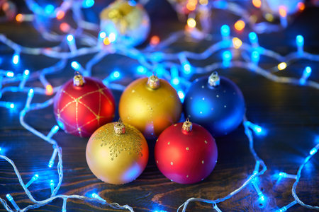 Christmas celebration holiday background. Colorful Christmas balls Christmas baubles and colorful xmas lights backgroundの写真素材