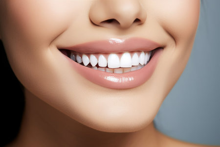Close-up of a woman's radiant smile with glossy lips and perfect white teeth. Generative AIの素材
