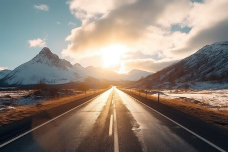 Majestic sunset over a straight road leading towards snow-covered mountains.. Generative AIの素材