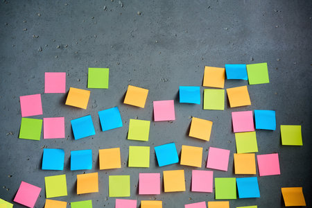 Blank colorful sticky notes on gray background