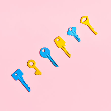 Various colorful keys on pink background. Flat layの写真素材