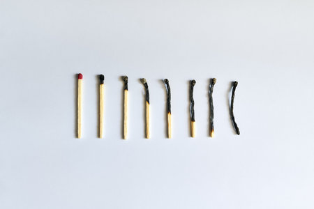 Burnt matches over white background. Emotional exhaustion conceptの写真素材
