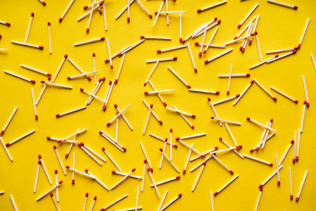 Wooden stick matches over yellow background. Flat Layの写真素材