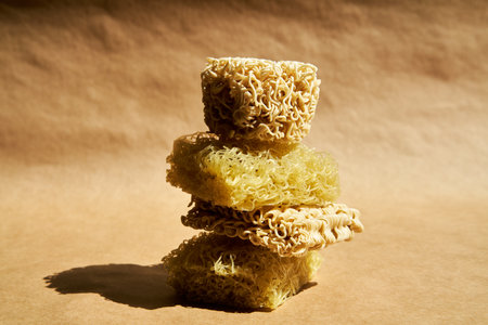 Creative food composition of instant ramen noodles over beige.の写真素材