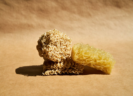 Creative food composition of instant ramen noodles over beige.の写真素材