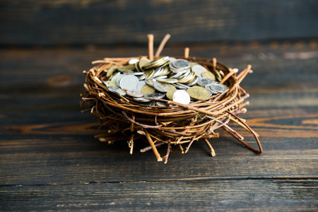 Nest filled with assorted metal coins. Financial growth, savings conceptの写真素材
