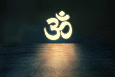 Bright glowing Om symbol on the wall in dark empty roomの写真素材