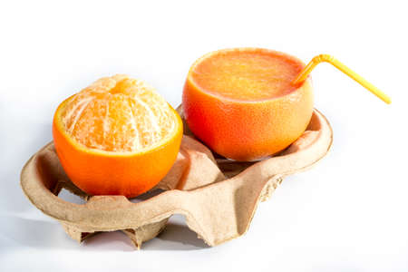 juice the grapefruit and orange on a standの写真素材