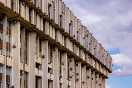 corner of large concrete building against the skyの写真素材