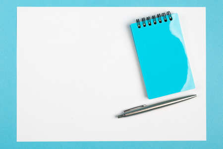 workspace top view. office Desk with office supplies. top view blue backgroundの写真素材