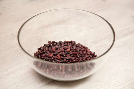 raw red beans lying in a glass bowl