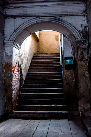 internal stone staircase in an old abandoned houseの写真素材