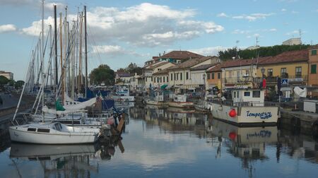Fishing boats at the dock in the fishing port in Cervia on the Adriatic coast of Italyのeditorial素材