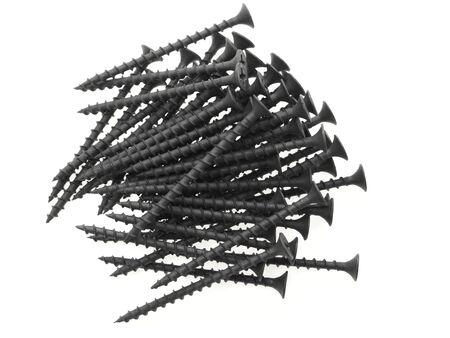 A pile of black screws. Isolated on white.
