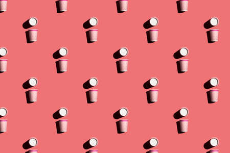 pink and white paper cup on pink background, patternの写真素材