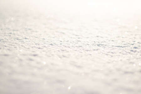 snow white cover with blurry background, used as a background or texture, soft focus