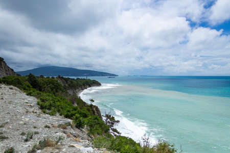 blue sea against the cloud sky, the view from the cliff, in the background cruise shipsの写真素材