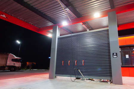 24-hour street self-service car wash, used as a backdrop