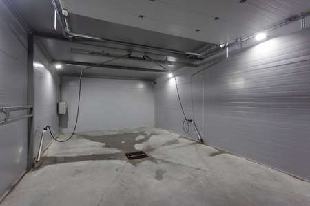 grey self-service car wash box, used as a backdropの写真素材