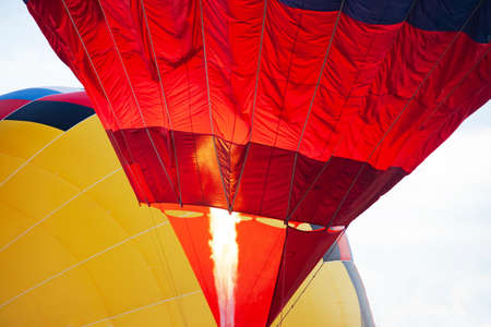 flame gondola and red balloon, in the background yellow balloonの写真素材