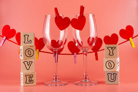 Postcard, a poster with a declaration of love. I love you. Wooden cubes. Red Hearts Garlandの写真素材