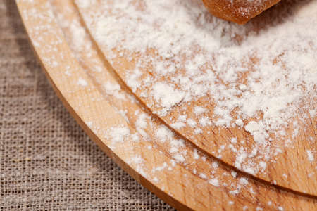 cutting board in flour close-up, copy space, use as backgroundの写真素材