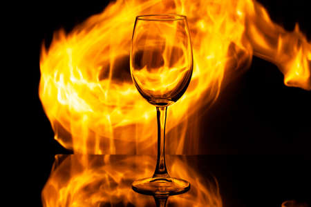 wine glass on fire, copy space, use as background