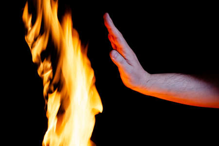 mens hand and burning flame, used as a background