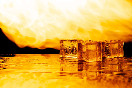 fire and ice, ice cubes and flames, black backgroundの写真素材