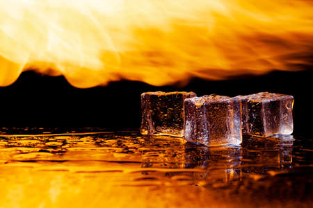 fire and water, flames and ice, black backgroundの写真素材