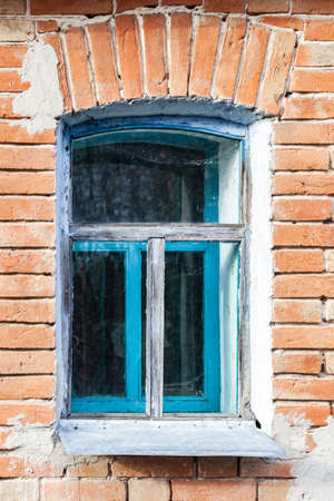 window in an abandoned house, an old concrete wall, an extinction villageの写真素材