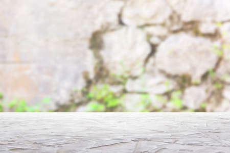 white textured surface on blur stone wall background