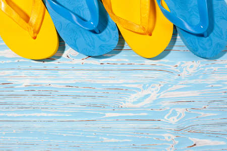 blue and yellow slaps on a wooden background, place under the text