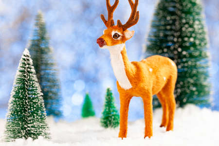 greeting new year card with deer in winter forestの写真素材