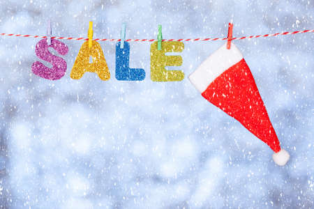 New year and christmas sale lettering on gray-blue glittering backgroundの写真素材