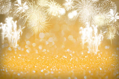 Gold fireworks and bokeh in New Year eve, copy space. Abstract background holiday