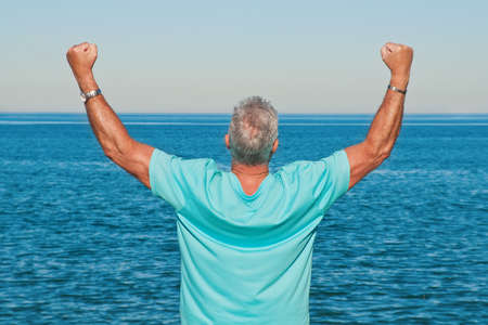 Happy man with open armsの写真素材