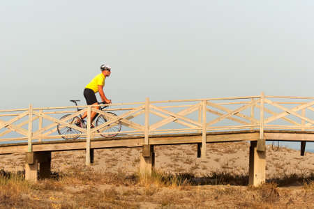 Senior man ridding a bicycleの写真素材