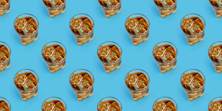 Alcohol in a glass, seamless pattern with pastel blue background. Minimalist natural luxury. Top view, flat lay.の写真素材