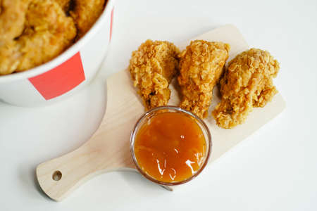Fried chicken wings with sweet and sour sauce.の写真素材